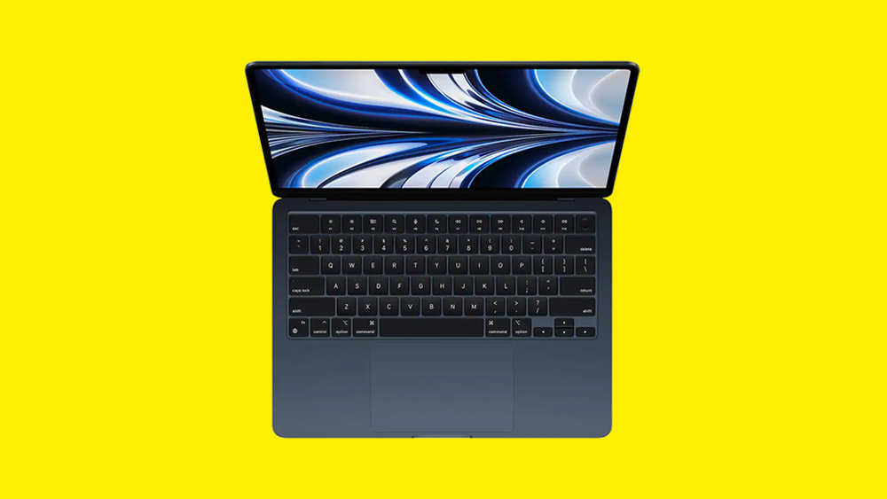 Oferta de Best Buy Black Friday para MacBook Air sobre un fondo amarillo brillante