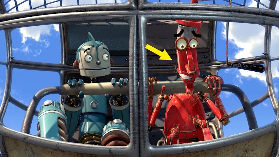 Dos robots animados, uno azul y otro rojo, están en un artilugio volador y parecen sorprendidos o emocionados.