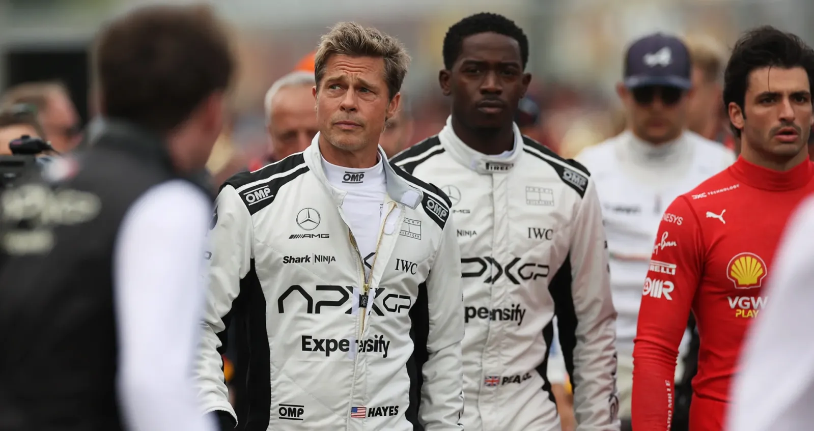 Two F1 drivers walk towards the camera